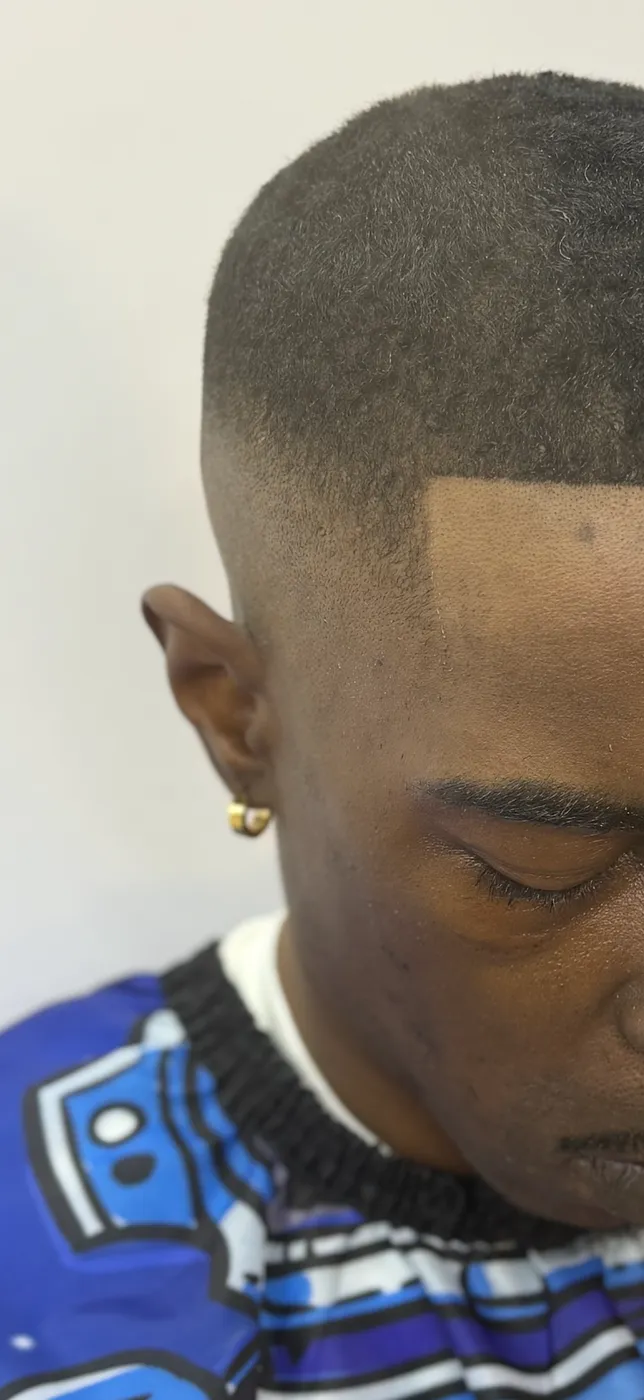 Bald fade with a hard part line, top view
